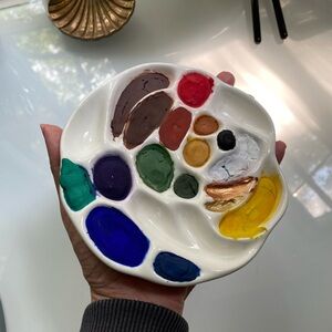 Handmade watercolor paint in ceramic palette